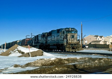 A coal train carrying coal in Colorado during winter