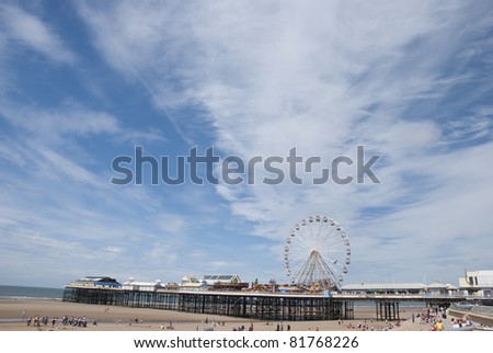 Central Pier Blackpool showing the Fairground Wheel under a summer sky