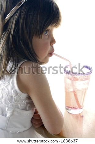 Girl drinking soda with a straw.