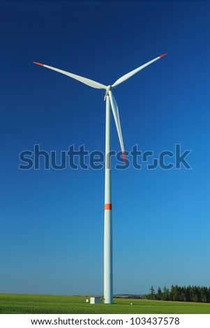 Wind turbine as alternative energy source against clear blue sky
