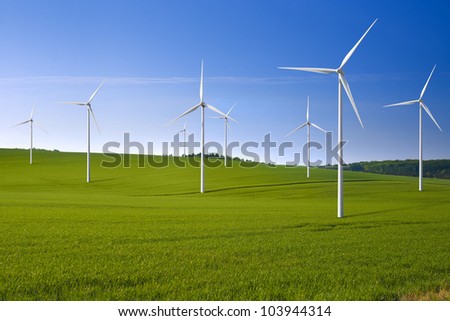 Wind turbine farm in the field - a renewable energy source
