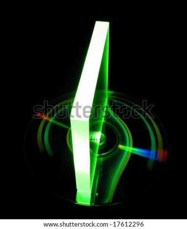 a glass plate on CD disk illuminated by green laser beam