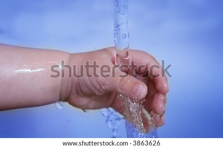Life! Baby hand and running water