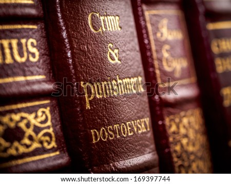 SALMON ARM, CANADA Ã¢Â?Â? DECEMBER 27, 2013: Close up of leather bound Crime and Punishment book spine showing author\'s name of Russian writer Fyodor Dostoevsky