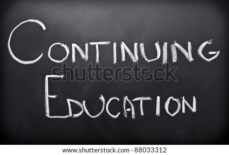 Continuing education written on classroom blackboard