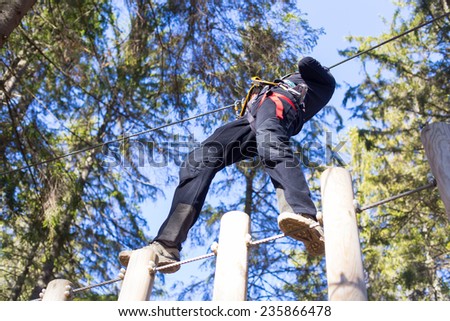 young woman having fun in an outdoor adventure park