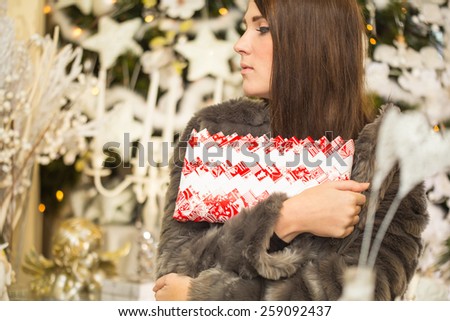 Handmade purse held by a cute brunette girl as Christmas present.