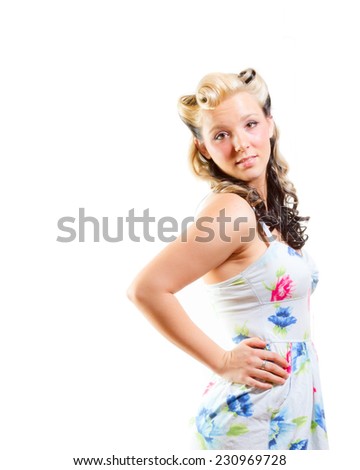 Young attractive woman in short modest dress on isolated white background
