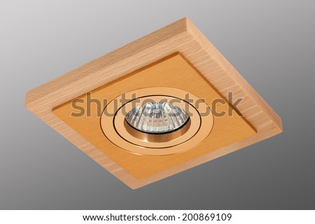 Gold spot lamp in a square light wooden frame