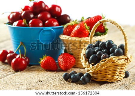 Summer fruits in rustic baskets