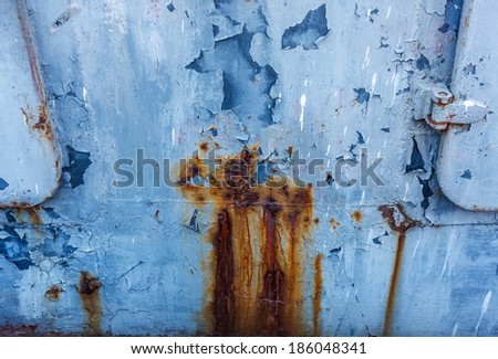 Blue painted on metal rusty background