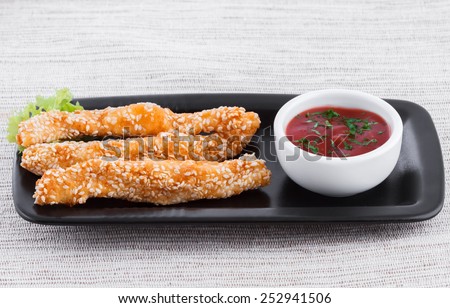 Fried fish fingers with sauce