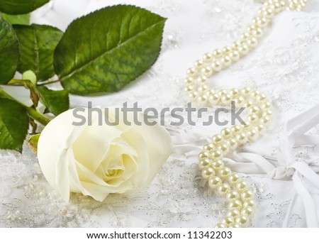nice wedding background wedding dress fabric with pearls and a white rose