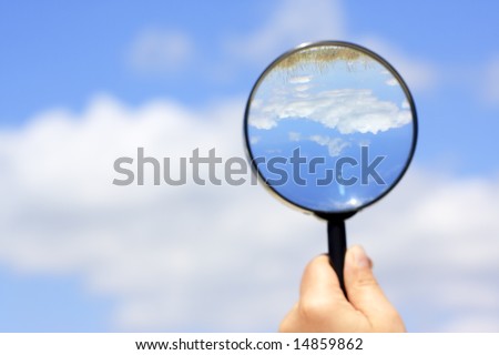 looking for the summer. landscape view through magnifying glass
