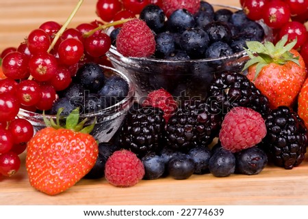 Wild fruits redcurrant, blackberry, raspberry and blueberry