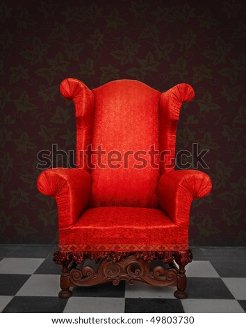 Red old armchair in a vintage room