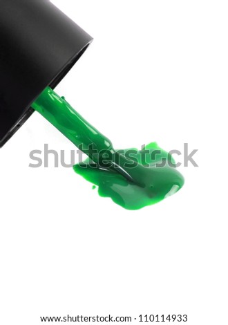 green nail polish brush on white