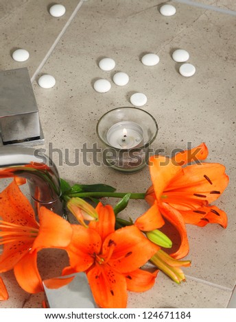 candle and  flowers in spa salon.shallow DOF
