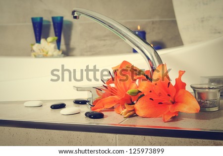 water tap with flowers in spa salon.shallow DOF