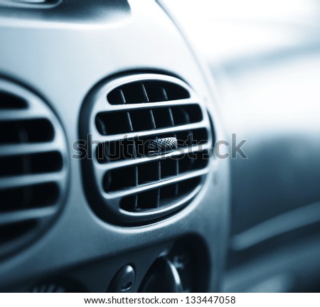 car interior.air conditioner. very shallow DOF. blue tone