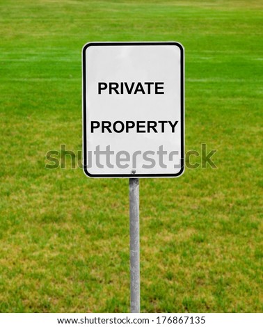 private property sign on the green lawn