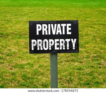 private property sign on the green lawn