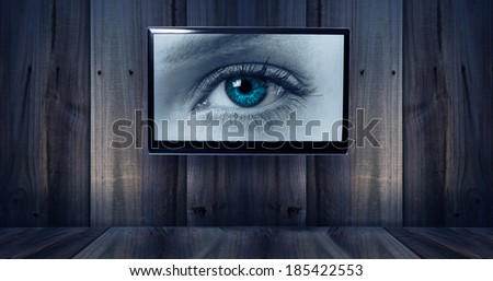 wooden background with tv and eye