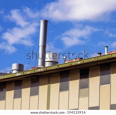 large factory details with blue sky