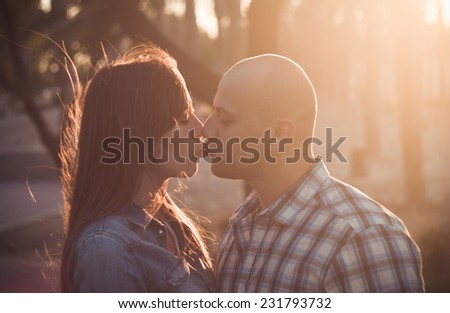 couple in love kissing in sunlight