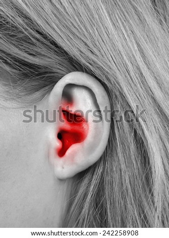 female  ear closeup,ear pain concept
