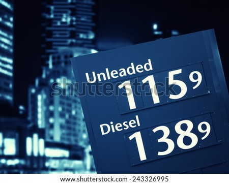 petrol prices on the fuel station on city background