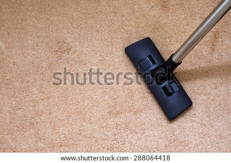 closeup of the vacuum on the carpet