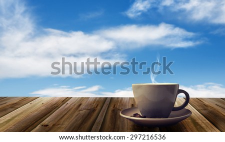 cup of coffee on abstract sky background