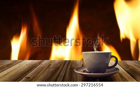 cup of coffee on abstract fire background