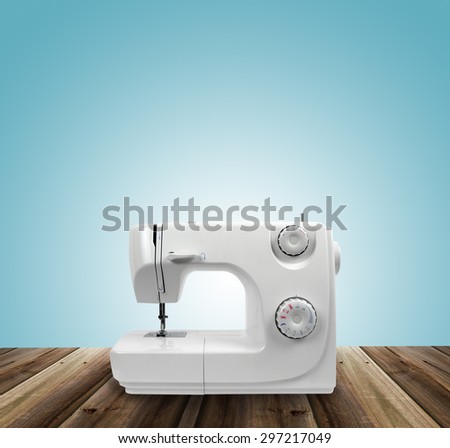 sewing machine on wooden surface