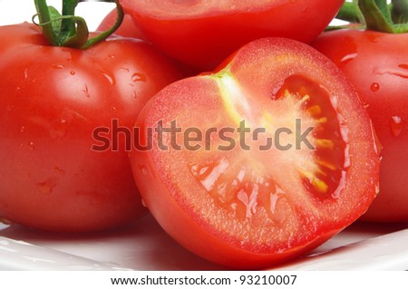 wet tomatoes closeup on plate