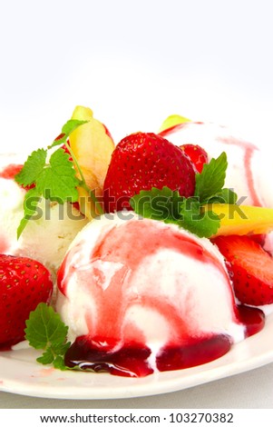 fruit ice cream with strawberries , apples and mint over white