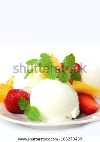 vanilla ice cream with fresh strawberries, apple and mint over white
