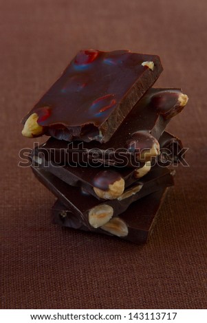 Pile of broken  dark chocolate with nuts