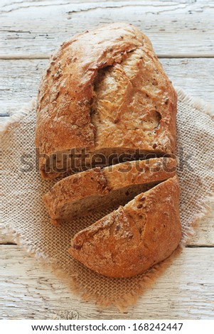 Whole wheat bread over wood background