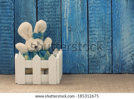 Easter background with toy rabbit