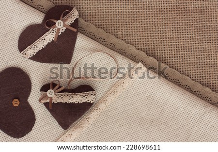 Scrapbook craft materials - laces, hearts, over canvas background
