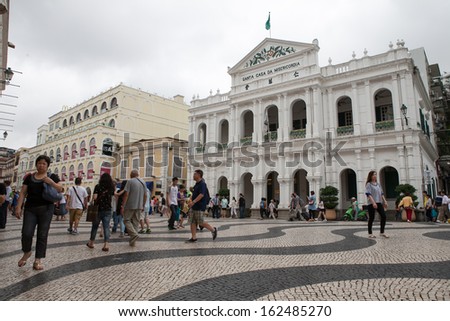 MACAU-JAN 16 : Tourists visit the Historic Center of Macao on Jan 16, 2013 in Macau, China. The Historic Centre of Macao was inscribed on the UNESCO World Heritage List in 2005.