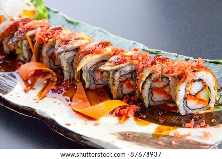Sushi rolls on a plate.