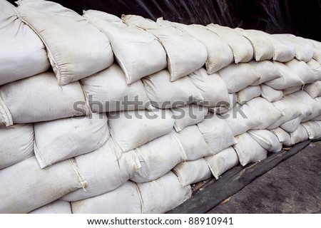 Sand bags help keep flood waters out of a town Process Flood protection