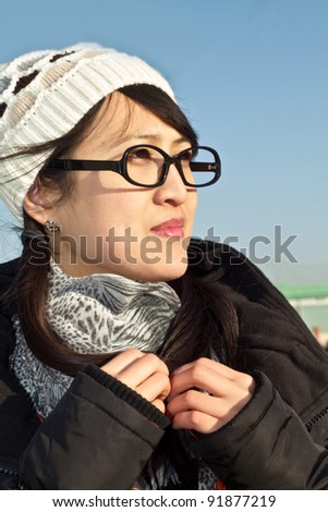 Beautiful fashion asian girl looking right, expecting the coming new year