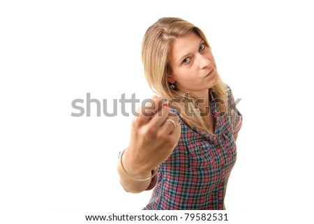 an angry woman threatening with her fist
