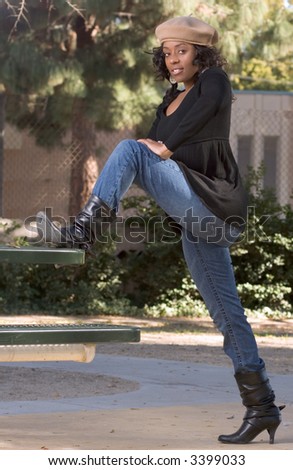Portrait of African-American girl  in jeans and boots