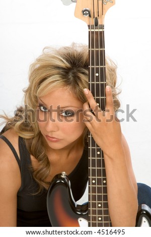 stock photo blonde Latina Girl posing with bass guitar