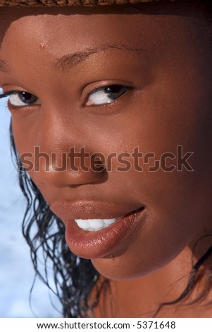 Portrait if African-American beauty with after sea (some water drops on face are visible)